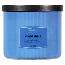Blue textured scented candle jar with black lid and centered label