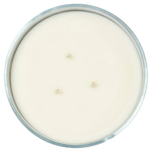 Unlit scented candle in frosted glass jar with black rim