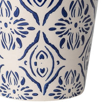 Round ceramic planter with blue floral medallion pattern, close-up lower section