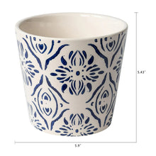 Round ceramic plant planter with blue medallion floral pattern and size markers