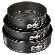 Stack of three round nonstick springform cake pans in dark gray with metal latch handles