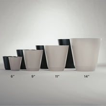 Set of self-watering resin planters in beige and dark tones, various sizes