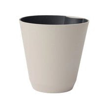 Beige self-watering resin planter with dark inner basin