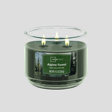 Green 3-wick scented candle in clear glass jar, Alpine Forest label on front