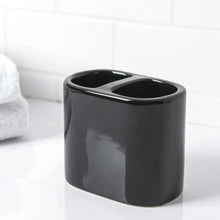Dark gray/black ceramic toothbrush holder with two slots for toothbrushes