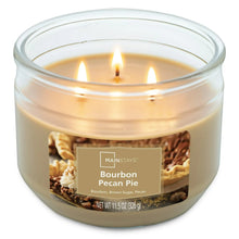 Glass jar candle with three lit wicks, beige wax, Bourbon Pecan Pie label.