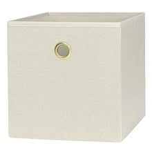 Beige fabric storage cube bin with gold grommet handle on the front face