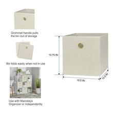Beige collapsible fabric cube storage bin with gold grommet handle