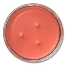 Mainstays cranberry mandarin candle with 3 wicks in an upside-down red wax jar