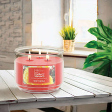 Mainstays cranberry mandarin 3-wick scented candle in a clear glass jar