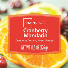 Mainstays cranberry mandarin candle label on red wax in a clear glass jar
