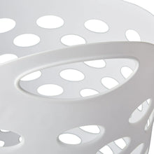 White plastic laundry hamper with oval carrying handle cutout and perforations