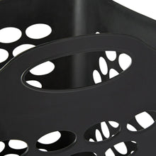 Black laundry hamper rim with oval cutouts and carry handle opening.