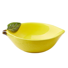 Yellow ceramic lemon bowl with green leaf handle on the rim