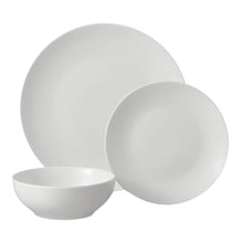 White stoneware dinner plates and bowls set, glazed finish, round shapes