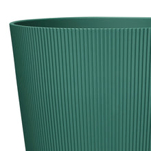 Green ribbed resin planter side view with vertical ridges