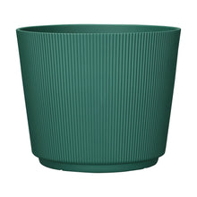 Green ribbed resin planter with wide round top and vertical textured ridges