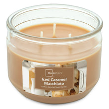 3-wick scented candle in clear glass jar with caramel-colored wax, unlit top view