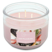 Pink 3-wick scented candle with three unlit wicks in clear glass jar