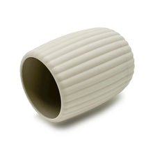 Beige ribbed rubberized plastic toothbrush holder, side view