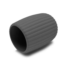 Grey ribbed toothbrush holder with dark interior, side view