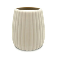 Beige ribbed rubberized plastic toothbrush holder with curved rim