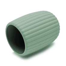 Green ribbed toothbrush holder, side view with dark interior opening