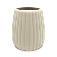 Beige ribbed plastic toothbrush holder with rounded cup shape