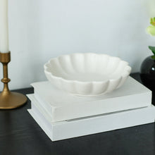 White scalloped decorative tabletop bowl with fluted rim