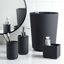 Black ribbed plastic toothbrush holders: tall cup, small cup, and square tray
