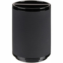 Black plastic toothbrush cup with ribbed texture and glossy top edge
