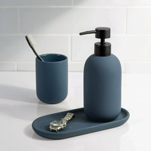 Blue ceramic toothbrush holder set with toothbrush, soap dispenser, and oval tray.