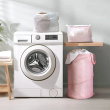 Pink polyester laundry hamper with stitched side seam and open top