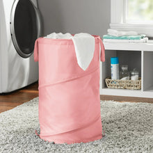 Pink pop-up spiral laundry hamper with open top and fabric handle loops