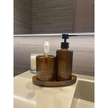 Brown plastic toothbrush holder with soap pump dispenser on matching base