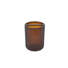 Brown plastic toothbrush holder cup with open rim and ribbed textured sides