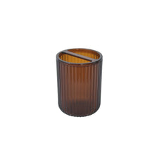 Brown plastic toothbrush holder cup, ribbed clear body with open top