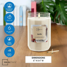 Vanilla scented glass jar candle with lit single wick in clear glass jar