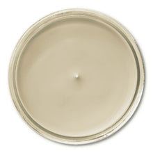 Vanilla candle wax surface inside glass jar, viewed from above