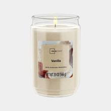 Vanilla scented glass jar candle with single wick, lit flame on top