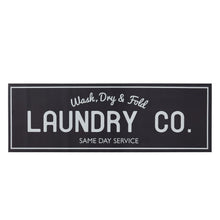 Black indoor laundry runner rug with 'LAUNDRY CO.' and service text
