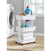 Arctic white 3-tier plastic rolling laundry cart with three open shelves and caster wheels