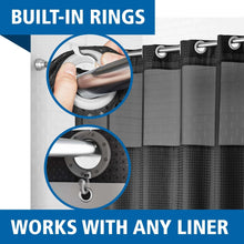 Close-up view of a dark shower curtain top with built-in ring attachments
