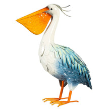 Metal pelican sculpture, white body with blue wing feathers and wide orange beak