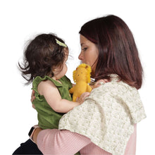 Plush lion baby rattle held during play with baby