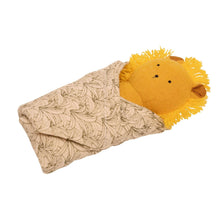 Plush lion baby rattle with leaf-pattern burp cloth, side view