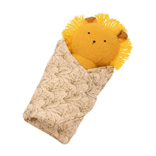 Plush lion baby rattle wrapped in leaf-pattern cotton burp cloth