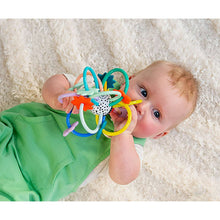 Infant loop rattle in use with baby, colorful rings and star-shaped parts