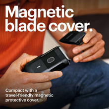 Black foil face shaver with magnetic blade cover partially shown