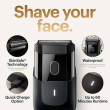Black electric foil face shaver front view with charging button